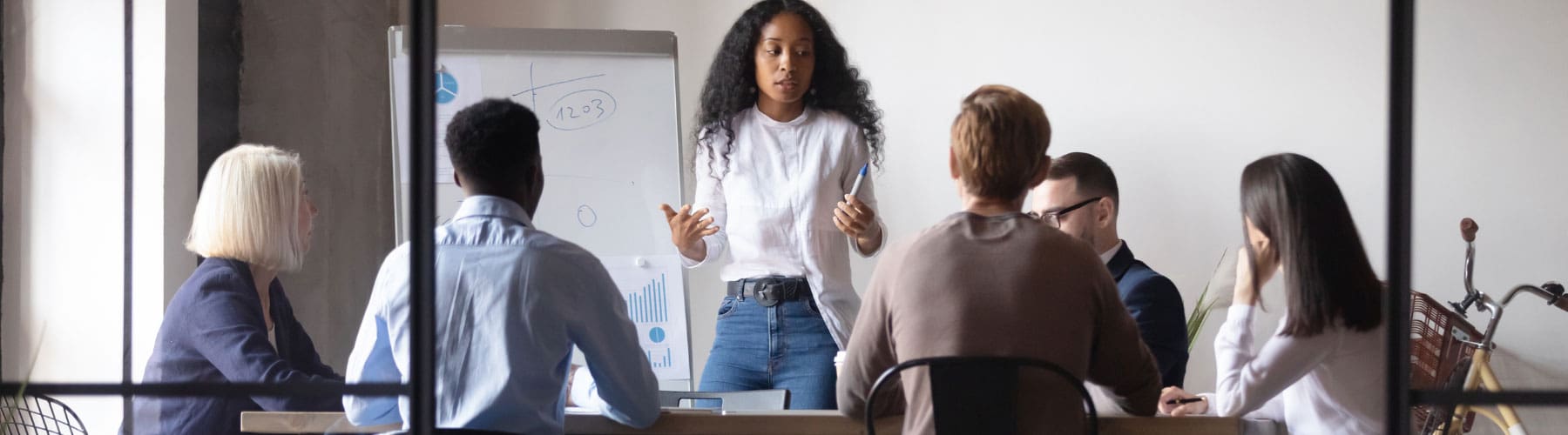 Nonprofit professional delivers a marketing presentation in a meeting.